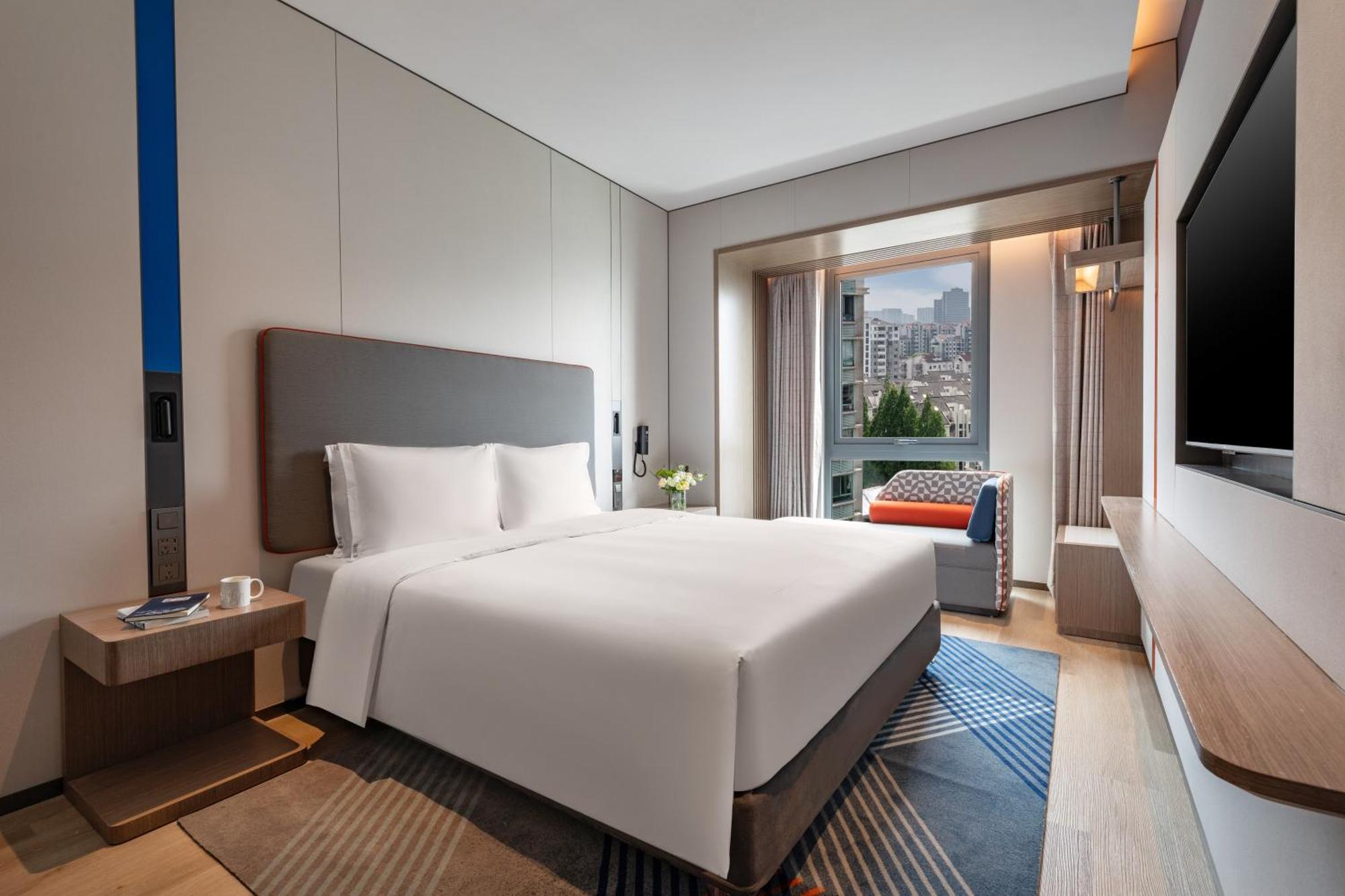 Holiday Inn Express Changfeng Park Шанхай Экстерьер фото